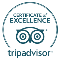A blue TripAdvisor “Certificate of Excellence” badge featuring a pair of glasses logo and circular seal, with the word “tripadvisor” at the bottom.